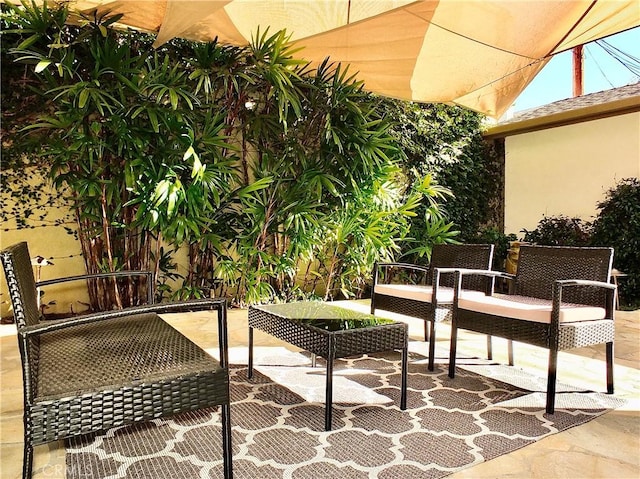 balcony with a patio area and an outdoor living space