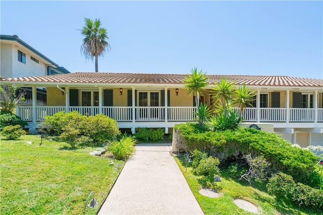 view of front of property with a porch and a front yard