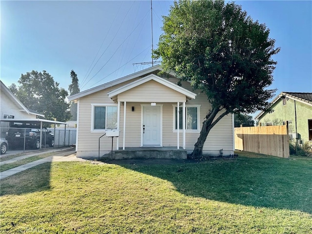 bungalow-style house featuring a front yard and a porch