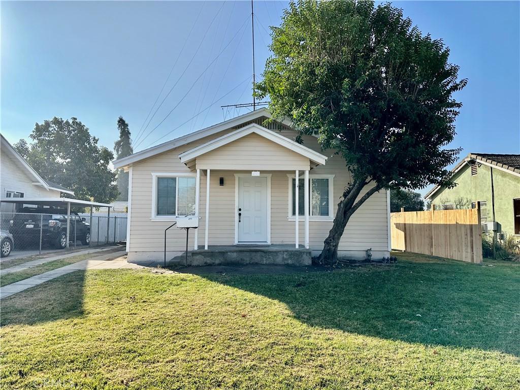 bungalow-style house with a porch and a front lawn