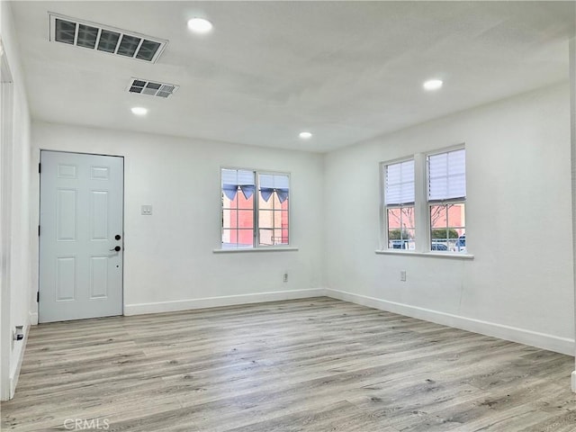 unfurnished room featuring light hardwood / wood-style flooring