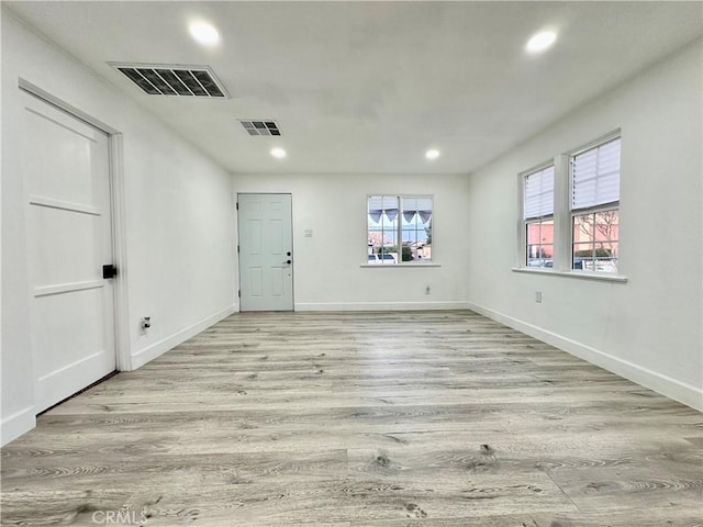 empty room with light wood-type flooring