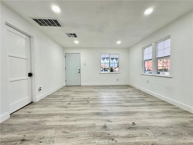 unfurnished room featuring light hardwood / wood-style floors