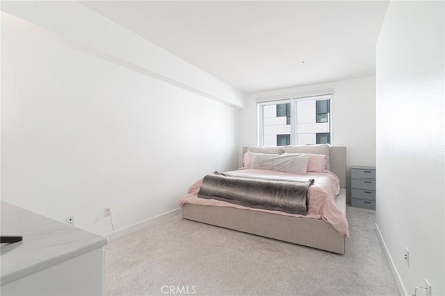 bedroom with light colored carpet