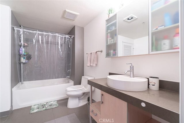 full bathroom featuring tile patterned flooring, vanity, shower / tub combo with curtain, and toilet