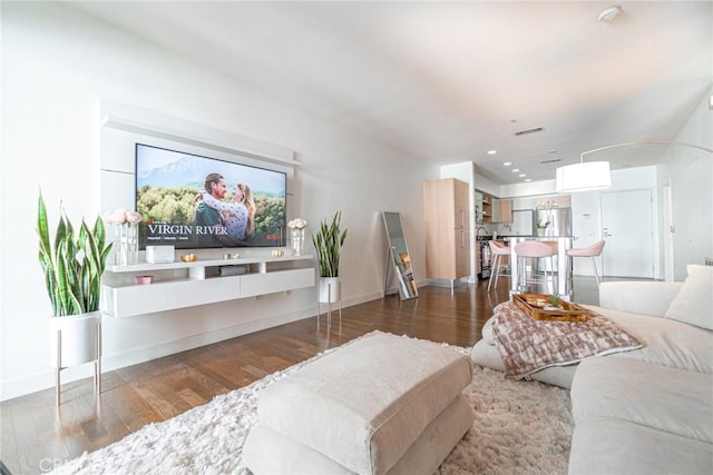 living room featuring dark hardwood / wood-style flooring