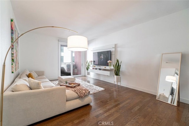 living room with dark hardwood / wood-style flooring