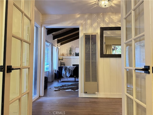 hall with french doors, vaulted ceiling with beams, and dark hardwood / wood-style floors