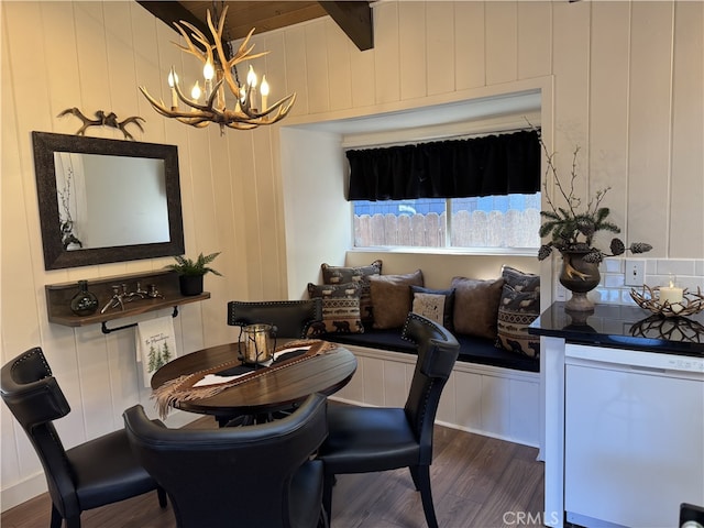 dining space featuring a chandelier and dark wood-type flooring