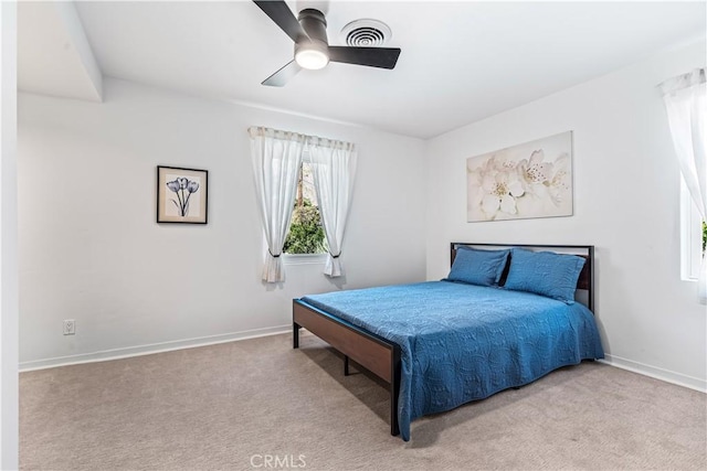 bedroom featuring ceiling fan and light carpet