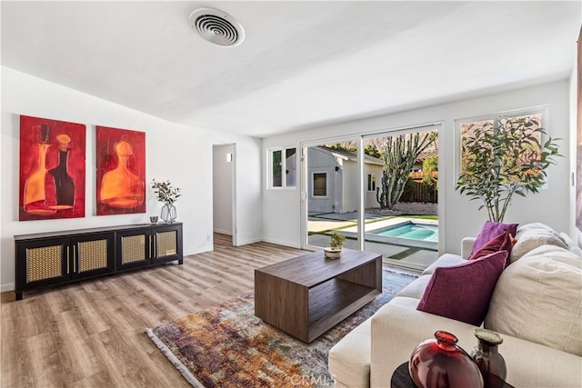 living room with light hardwood / wood-style floors