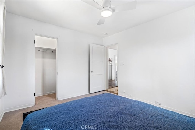 unfurnished bedroom featuring ceiling fan and light carpet