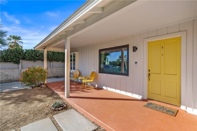 property entrance with covered porch