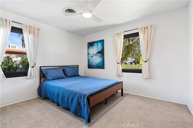 carpeted bedroom with ceiling fan