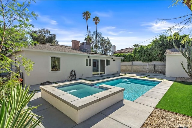 view of pool featuring an in ground hot tub and a patio area