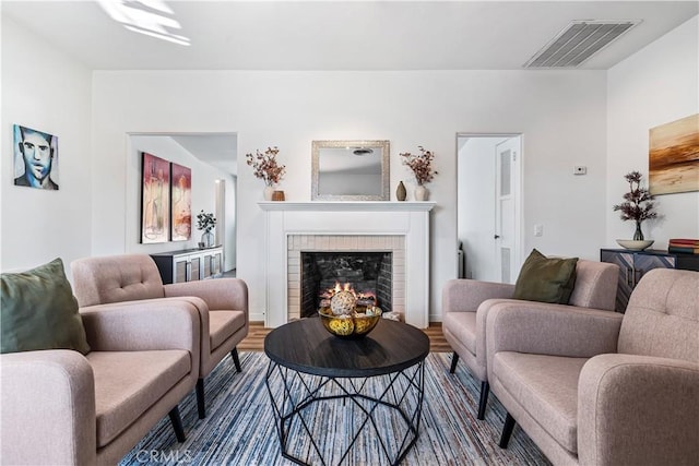 living room with a fireplace and hardwood / wood-style flooring