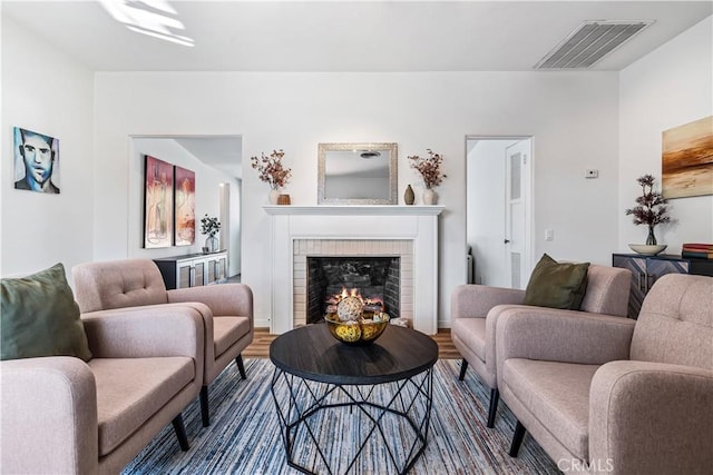 living room featuring a fireplace and hardwood / wood-style flooring