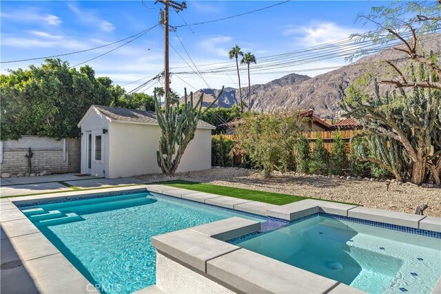 view of swimming pool featuring a mountain view