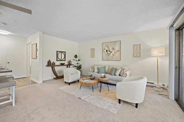 carpeted living room featuring a textured ceiling