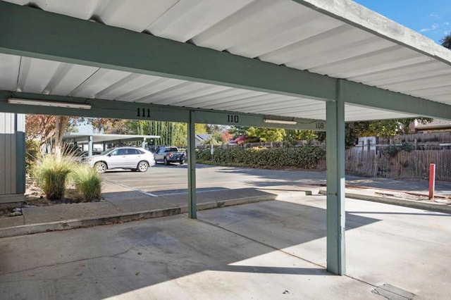 view of parking / parking lot with a carport