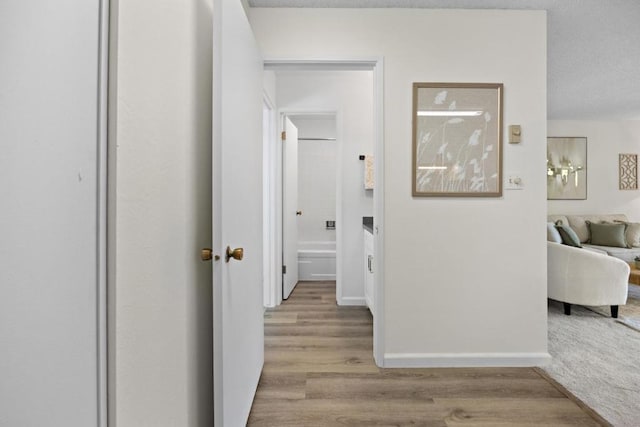 hall with light wood-type flooring