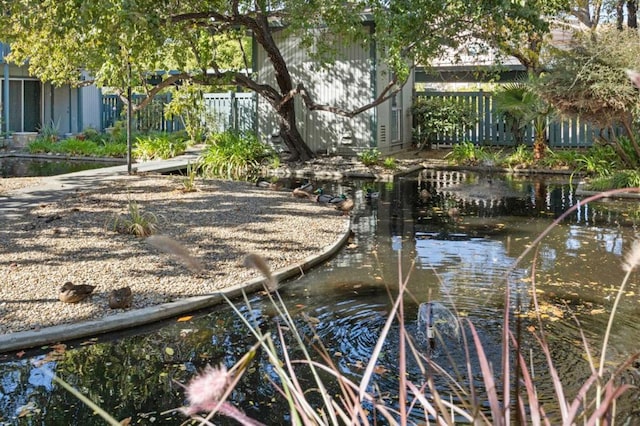 exterior space with a small pond