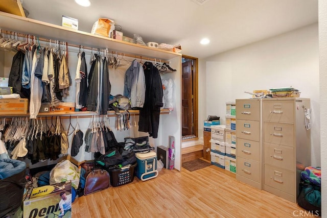 spacious closet with light hardwood / wood-style flooring