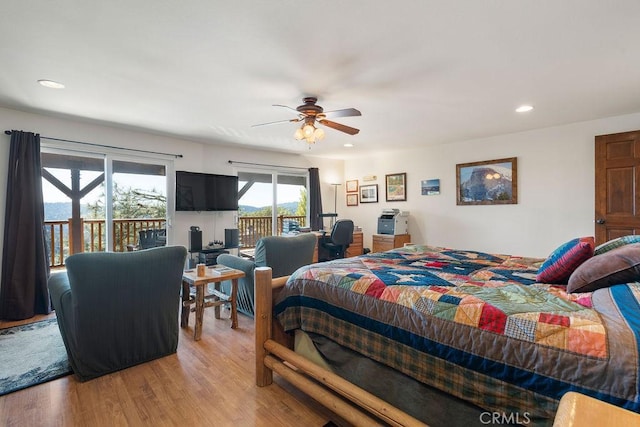 bedroom featuring access to exterior, ceiling fan, and light hardwood / wood-style flooring