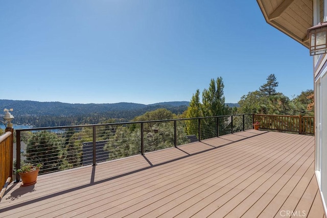 wooden deck with a mountain view