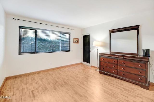 unfurnished bedroom featuring light wood-type flooring