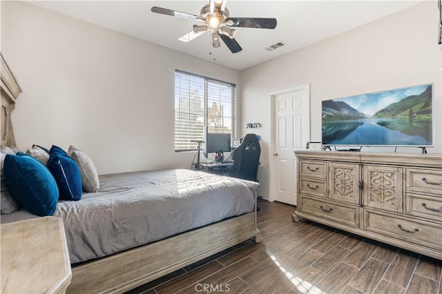 bedroom featuring ceiling fan and dark hardwood / wood-style floors