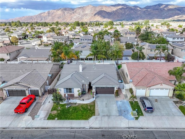 birds eye view of property featuring a mountain view