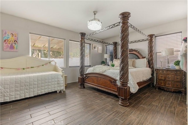 bedroom with dark wood-type flooring