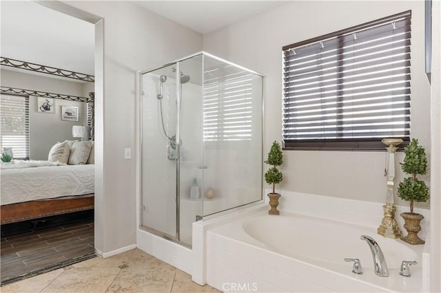 bathroom featuring plus walk in shower and tile patterned floors