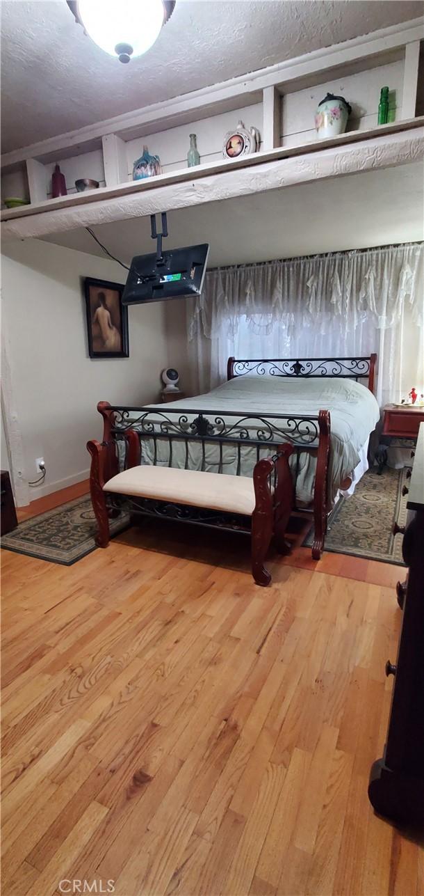 bedroom featuring hardwood / wood-style flooring