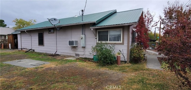 back of property featuring a wall mounted air conditioner