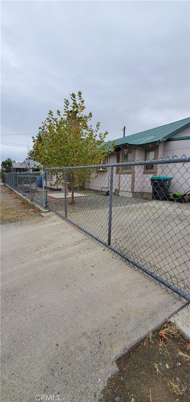 view of gate with fence