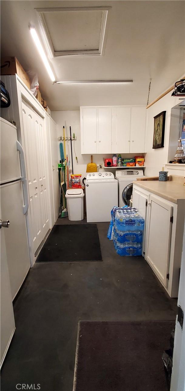 interior space with cabinets and independent washer and dryer