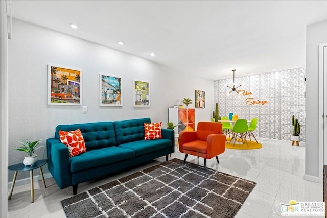 living room with tile patterned flooring and a notable chandelier