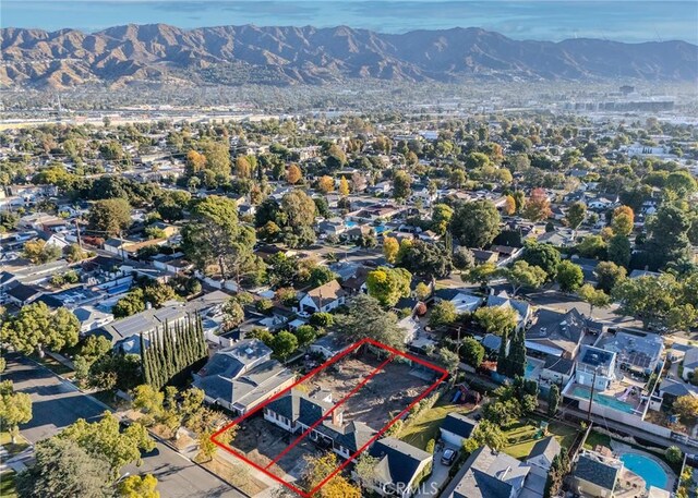 drone / aerial view featuring a mountain view