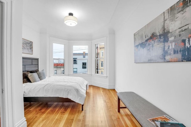 bedroom with hardwood / wood-style floors