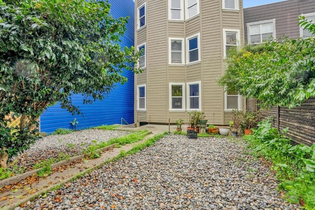 view of side of home with a patio area