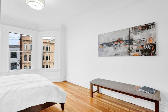 bedroom with wood-type flooring