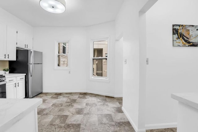 kitchen with white cabinetry and stainless steel appliances