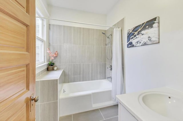 bathroom with tile patterned floors, vanity, and shower / tub combo