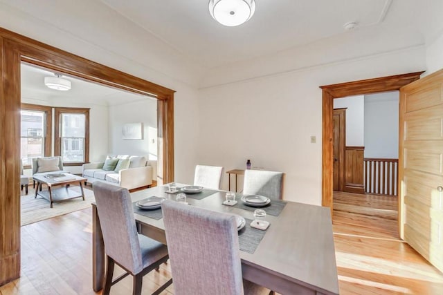 dining space with light hardwood / wood-style flooring