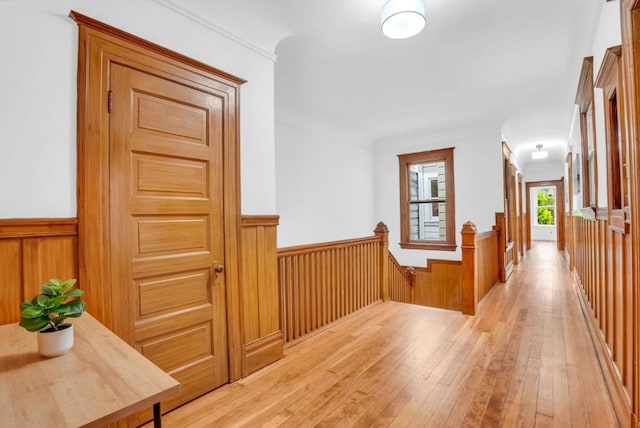 hallway with light hardwood / wood-style flooring