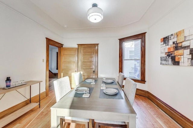 dining room with light hardwood / wood-style flooring