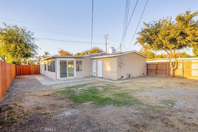 rear view of property with a patio area