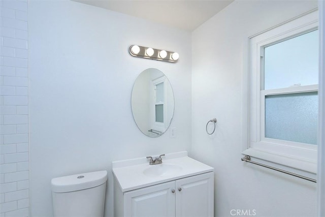 bathroom with toilet and vanity